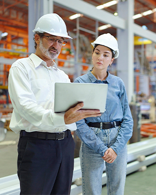 Manager and employee discussing benefits and looking at a tablet