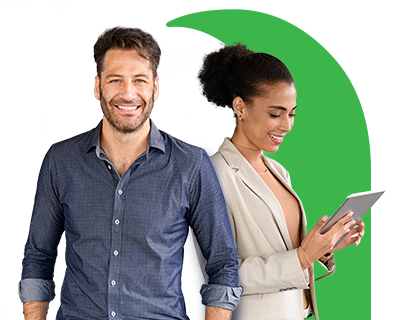 Two people smiling one of them looking at her tablet.